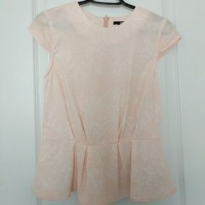 Baby pink peplum blouse.